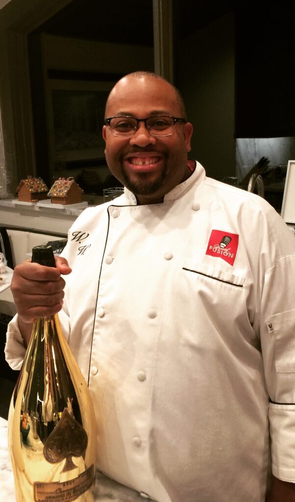 Chef Wendell White working a private chef event, reflecting on identity, work, and professional pressure.
