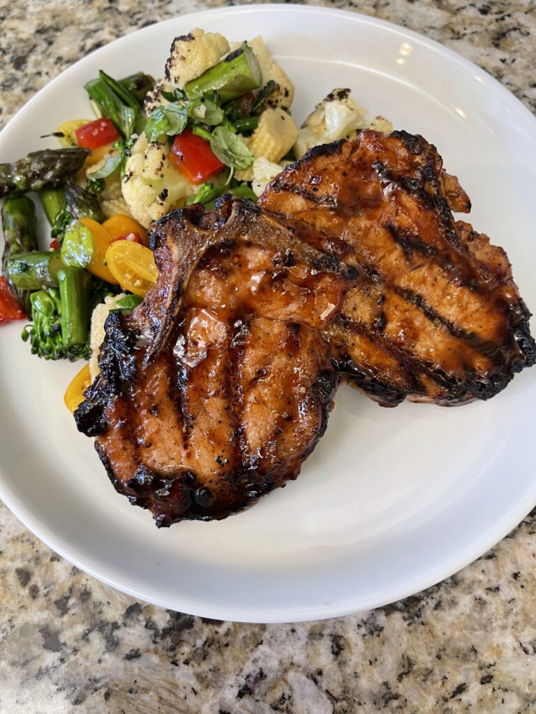 BBQ pork chops with grilled vegetable salad prepared by Chef Wendell White