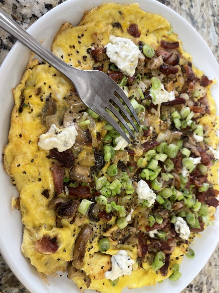 Chef Wendell White loaded frittata with caramelized mushrooms, bacon, goat cheese, and fresh green onions